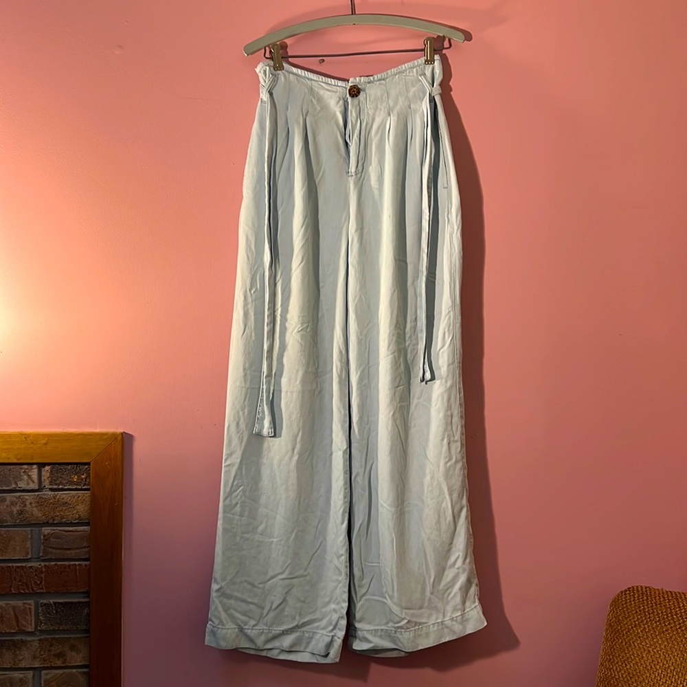 High-waisted, wide-legged light wash jeans